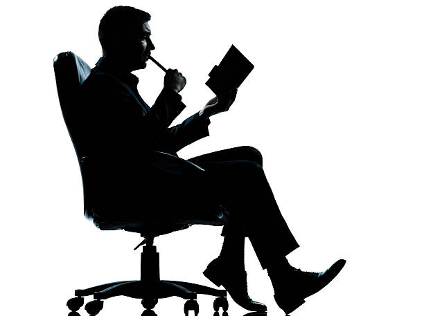 istock one business man with agenda taking notes sitting in armchair 153240843