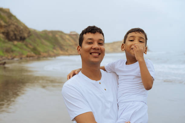 istock Father and son on the beach coast 1532417754