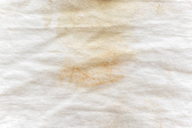 istock Dirty white cotton fabric. Stains on shirt. 1532439905