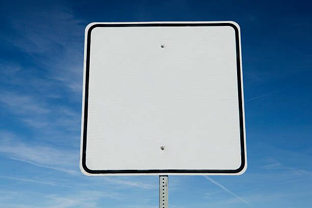 istock Blank white road sign against a clear blue sky 153244042