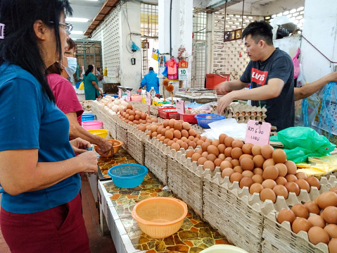 Rifle Range wet market,\nRifle Range flat, Air Itam, Penang, Malaysia \n10 July 2023, 10am\n\nPhotos of customers buying chicken meat and eggs at the above indoor wet market. Opens only in the morning.