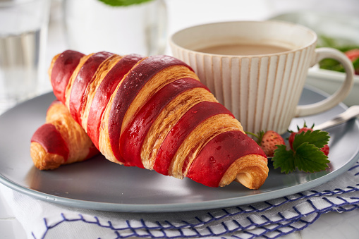 Croissants with two colors of stripes, including red