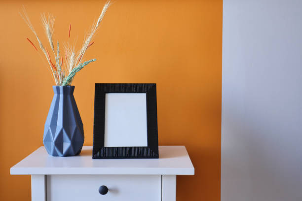 istock Black photo frame mockup in a living room 1532462105
