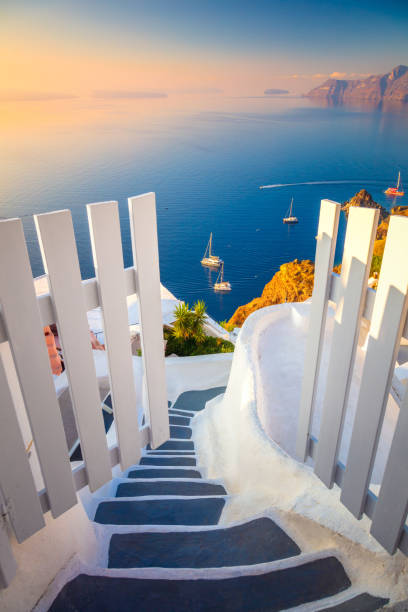 istock Gateway to rest. Santorini, Greece. White architecture, open doors and steps to the blue sea of Santorini island, Oia. 1532462434