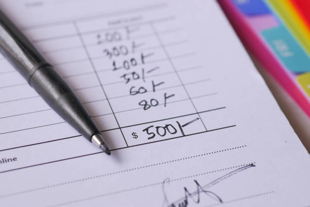 istock A man writes payment due in a paper form 1532462621