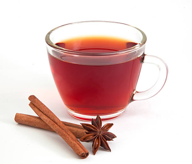 Cup of tea with anise star and cinnamon stock photo