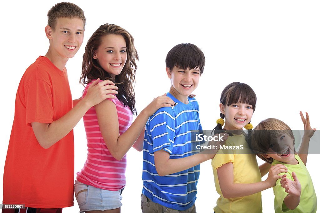 Happy siblings Smiling brothers and sisters standing in a line in order of age with hands on shoulders. Beautiful People Stock Photo