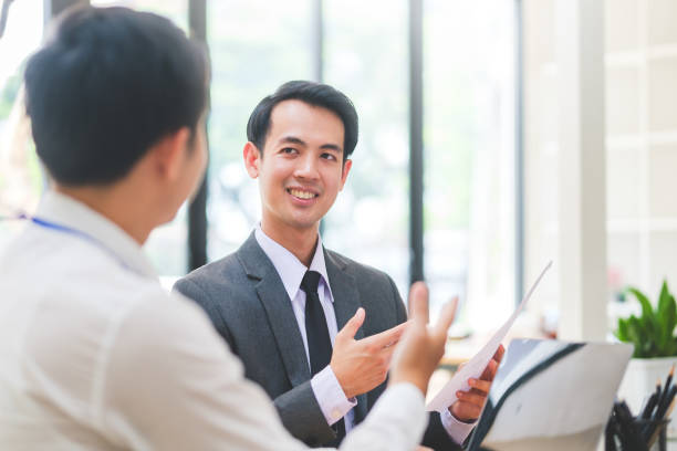 istock Young business colleagues brainstorming, discussing financial statistics together, developing marketing plan at office. 1532517297