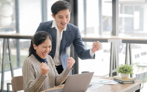 istock Business team celebrating successful project or achievement in office. Teamwork, collaboration concept. 1532526663