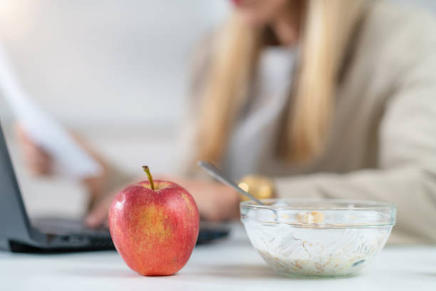 istock Workday with Healthy Eating: Apple and Muesli in Focus 1532533906