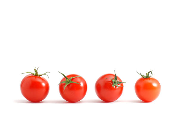 Isolated set of cherry tomatoes organized in a row Cherry tomatoes over white cherry tomato stock pictures, royalty-free photos & images