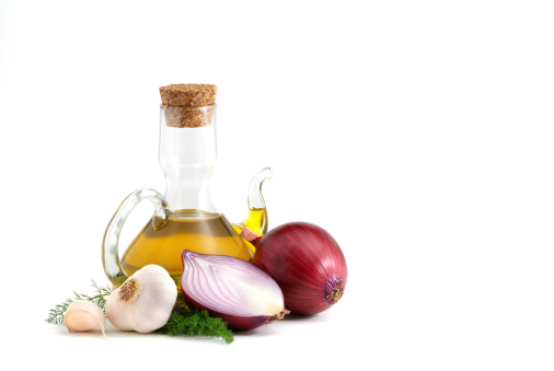 Red onions, garlic and olive oil isolated over white