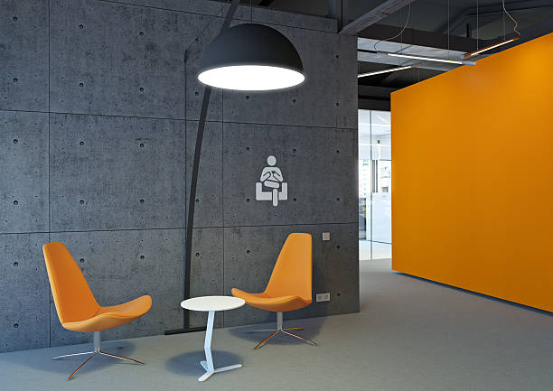 Orange and gray office area with two chairs stock photo