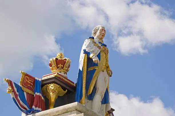 Monument to King George III with the monarch standing in front of a table surmounted by a crown, Esplanade, Weymouth.  Erected in 1810 to mark the Golden Jubilee of the King who popularised the seaside resort.