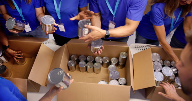 Food Bank Humanitarian Aid In Donation Boxes Food Bank Humanitarian Aid In Donation Boxes. Volunteer Community food bank stock pictures, royalty-free photos & images