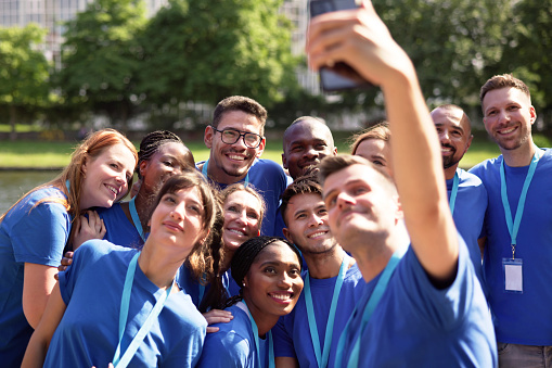 Volunteer People Taking Selfie Photo. Happy Group