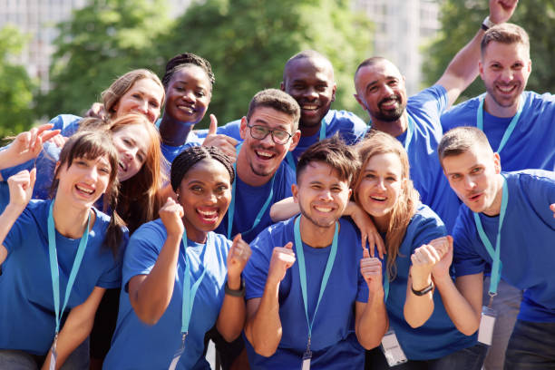 istock Cheerful Volunteer Team In Park 1532565576