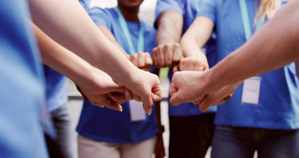 Volunteer Charity Team Joining Hands Together stock photo