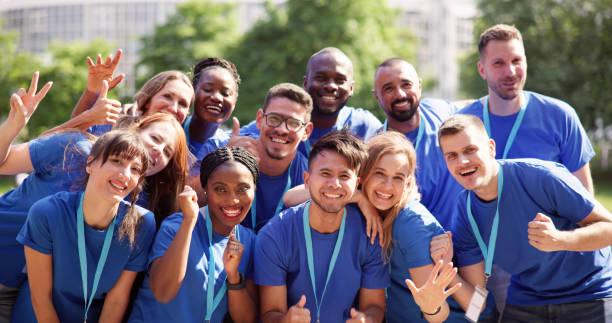 istock Cheerful Volunteer Team In Park 1532565813
