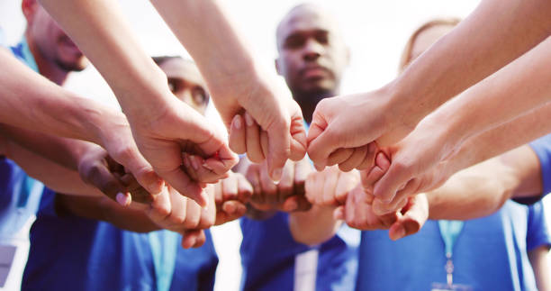 istock Volunteer Charity Team Joining Hands Together 1532565829