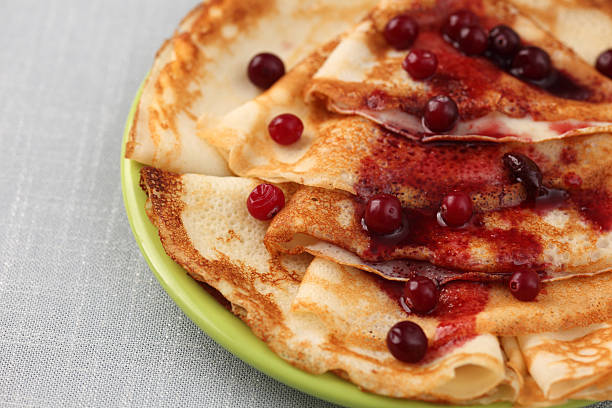 istock Pancakes (Blini) with cranberry on a plate 153258716