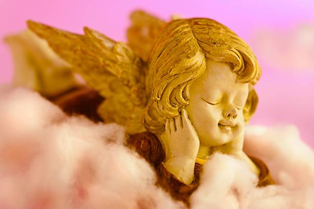 istock Angel resting on clouds and enjoying the sun head 153261198