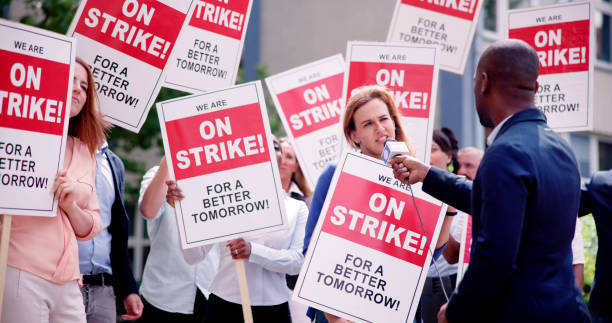 istock Workers Strike Demonstration In City. Labor Union March 1532619159