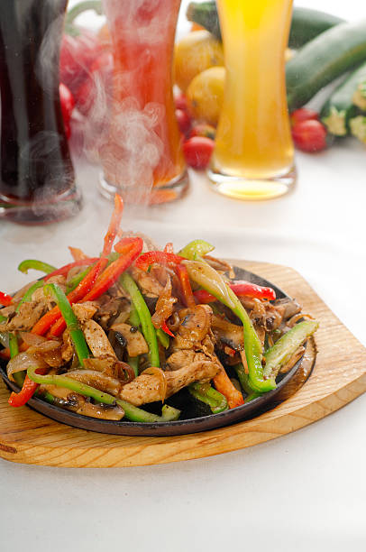 istock original fajita sizzling hot  on iron plate 153262398
