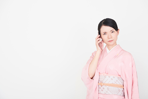 A woman wearing a kimono, the traditional costume of Japan