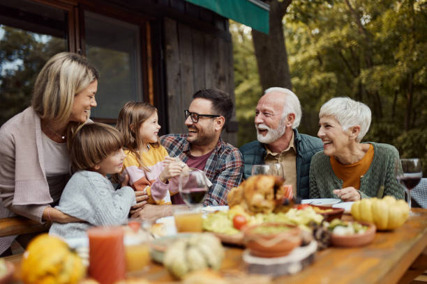 istock Cheerful extended family having fun during lunch on a terrace. 1532629764