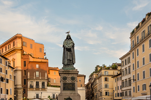 Giordano Bruno statue in Rome with a seagull on the head. Funny photo
