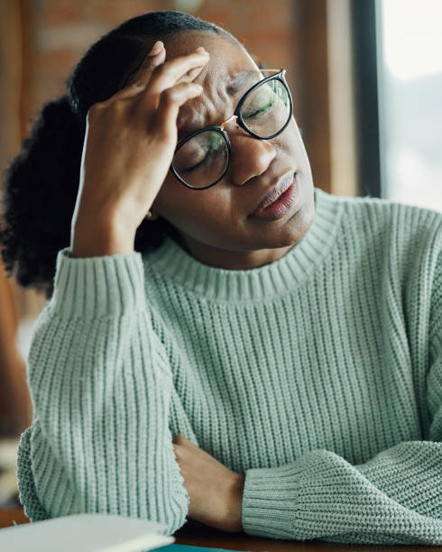 istock Young black woman having a headache at home. 1532645174
