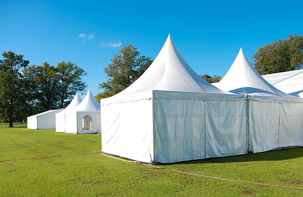 A set of large white event tents