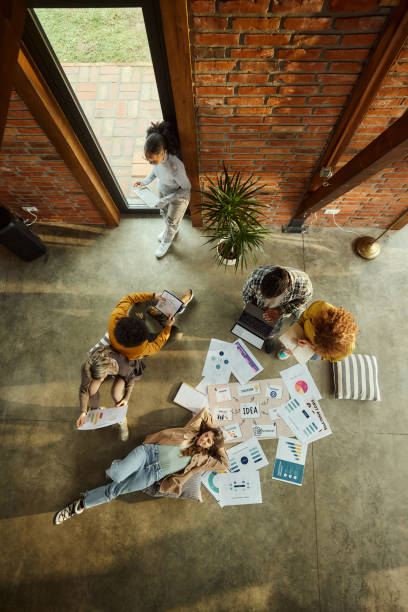 istock Above view of creative team working at casual office. 1532655494