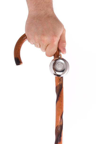 istock Men's hand holding walking stick with bell 153265720