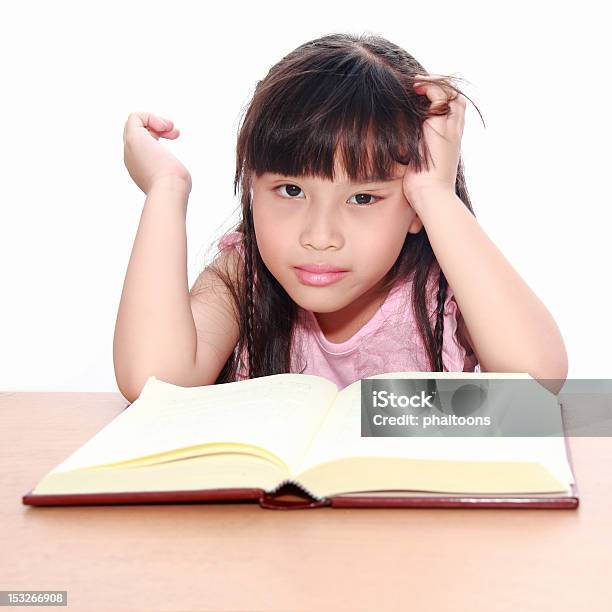 Serious Little Girl Reading A Book Stock Photo - Download Image Now - Book, Child, Childhood