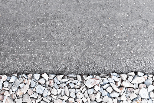 Texture of asphalt and crushed stone of the finished roadway