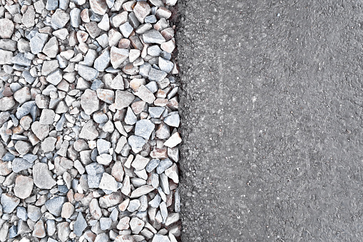 Texture of asphalt and crushed stone of the finished roadbed vertically