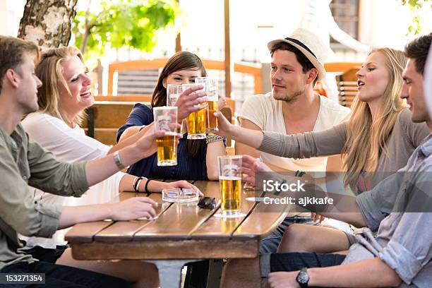 Friends Drinking Beer Stock Photo - Download Image Now - Beer Festival, Celebratory Toast, Table