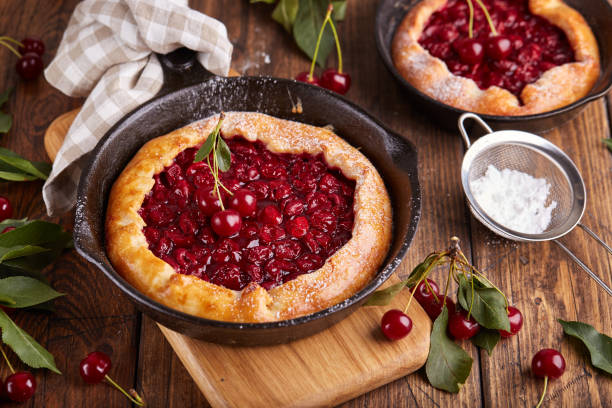istock Open sweet pie tart with cherries and sugar powder 1532715910
