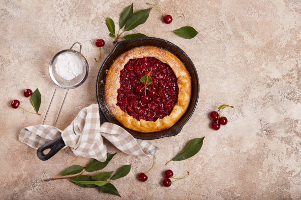 istock Open sweet pie tart with cherries and sugar powder 1532716149