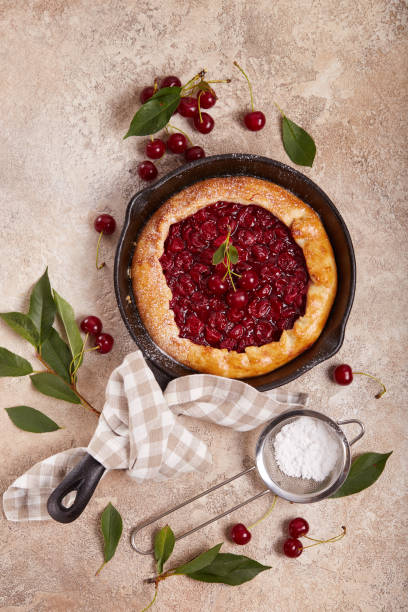 istock Open sweet pie tart with cherries and sugar powder 1532716196