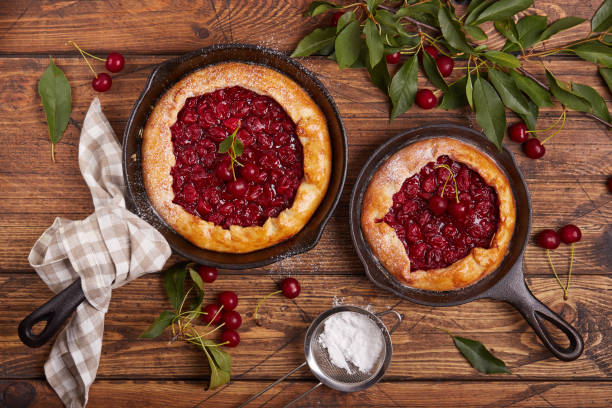 istock Open sweet pie tart with cherries and sugar powder 1532716203