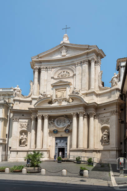 istock Renaissance church squeeze between the building in Rome. Ancient Sun clock on the wall 1532722389