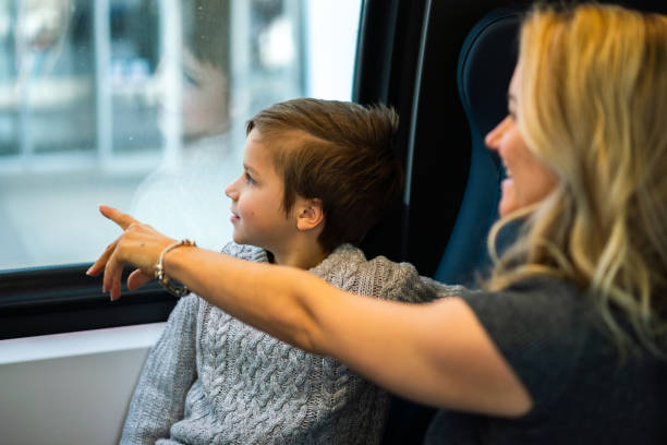 istock Mother travelling on train with son 1532722920