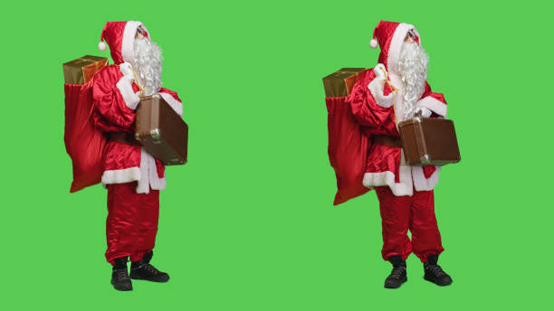 istock Father christmas with sack and suitcase 1532723462