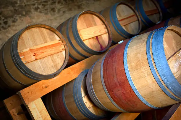 Wine barrels in the cellar of a vineyard near Bordeaux