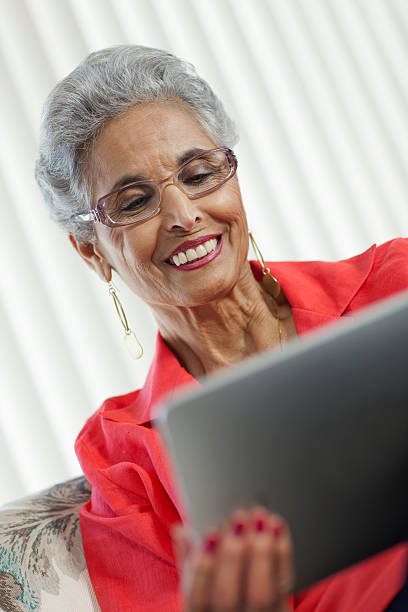 Senior woman with Digital Tablet stock photo