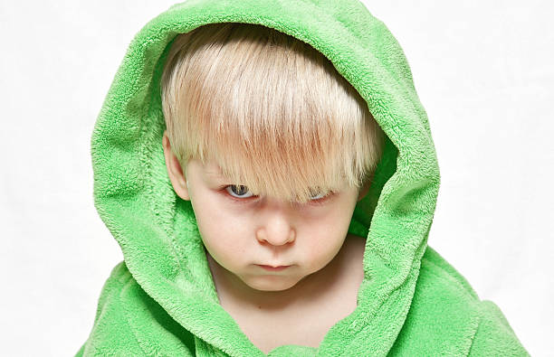 istock serious boy in green dressing gown 153274057
