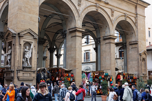 Firenze, Italy - 8 april 2023: Porcellino Market with many Tourists, ancient Covered Market in Florence, Italy.